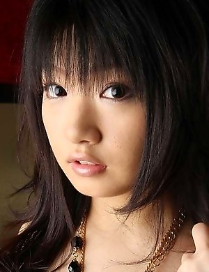 Cute Asian takes off her bikini top