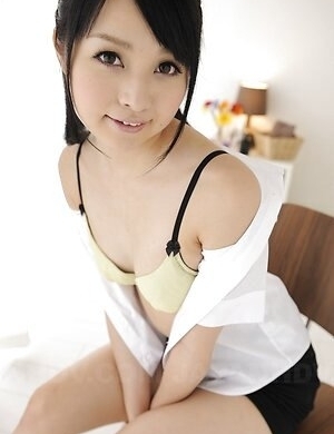 Nozomi Aiuchi with sweet tits and hairy pussy takes clothes off.